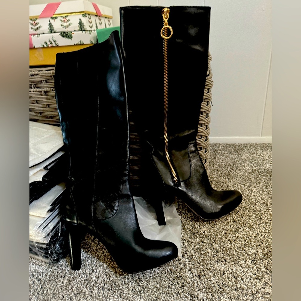 Womens black leather high-heel,  knee high boots. Once worn a couple of times.